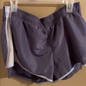 Purple athletic shorts. Reflective